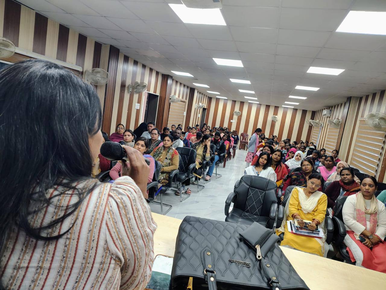 A full community hall during a Kalp Taru Movement session